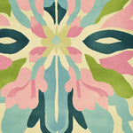 Vibrant Mosiac Garden Whisper hand-tufted area rug showcasing an abstract floral pattern with pastel hues of pink, blue, and green. This contemporary wool rug is perfect for adding a splash of color to living room area rugs.