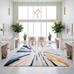Modern interior with a colorful abstract rug, pink chairs, and large windows.