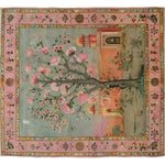 This Mughal Garden Hand Knotted Area Rug features a beautifully intricate design with a prominent tree adorned with pink blossoms, set against a serene landscape backdrop. The vintage rug is perfect for adding elegance to your living space, making it an ideal choice for area rugs for living room settings. Measuring 8x10, this Persian-inspired rug combines traditional artistry with modern flair, enhancing any home decor with its timeless appeal.