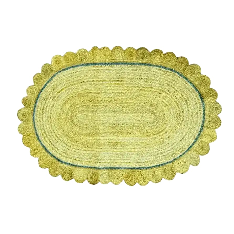 This image showcases a mustard scalloped jute area rug, perfect for adding a touch of boho charm to your living room. The rug is large, ideal as a living room rug in an 8x10 space, and combines both jute and wool for a textured and durable finish.