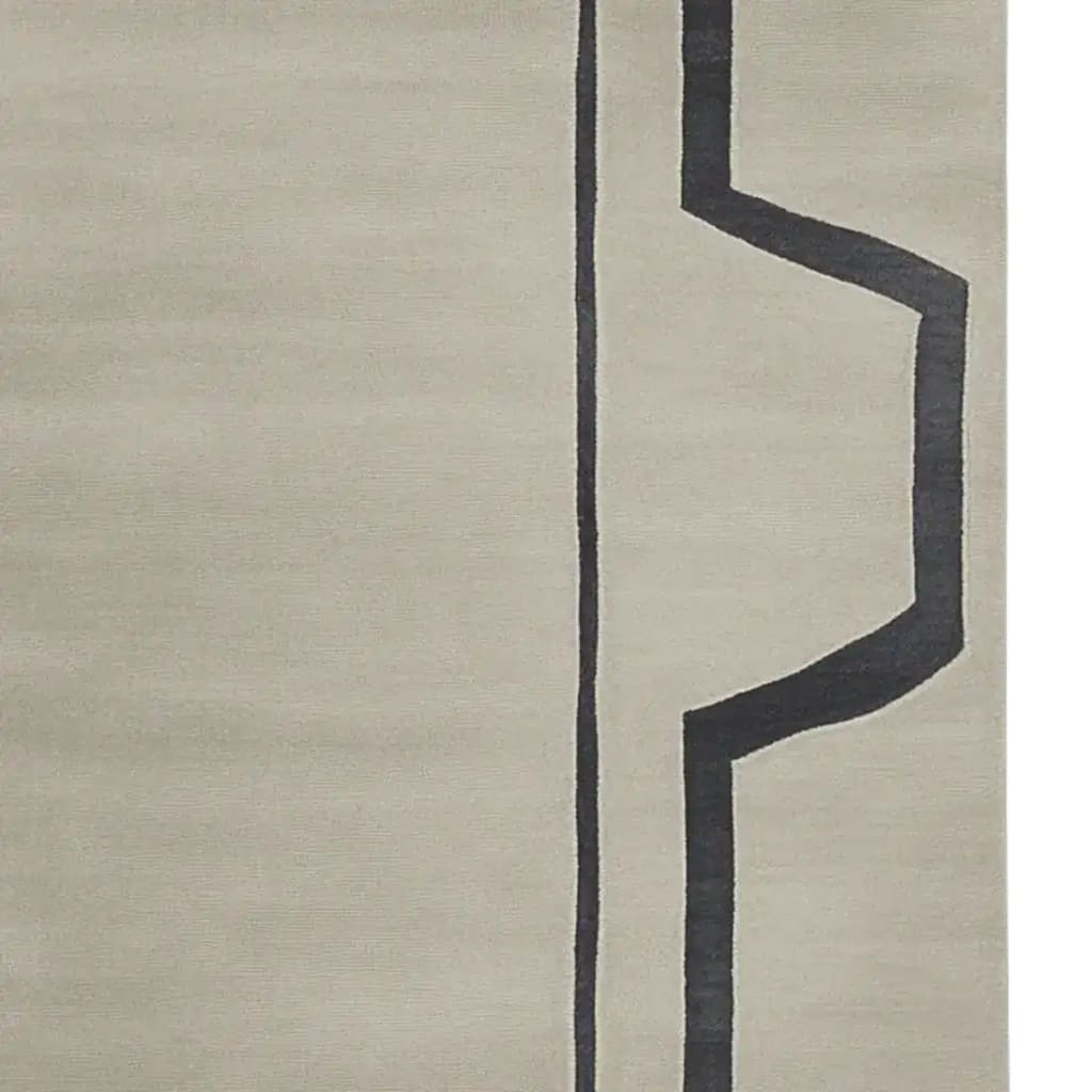 This image showcases the Muted Modern Line Hand Tufted Rug, a stylish area rug perfect for contemporary living rooms. The rug features a minimalist design with bold, geometric black lines on a soft, woolen background, adding a touch of elegance to any space.