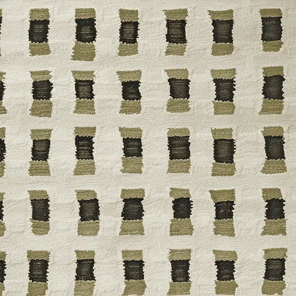 Close-up view of a contemporary hand-knotted wool area rug featuring a modern geometric pattern in muted tones, ideal for enhancing living room spaces.