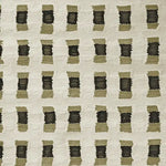 Close-up view of a contemporary hand-knotted wool area rug featuring a modern geometric pattern in muted tones, ideal for enhancing living room spaces.
