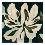 Top view of the Muted Petal Dance Hand Tufted Area Rug, featuring a contemporary floral design in soft pink and green hues on a dark background. This square wool rug is perfect for adding a stylish touch to any living room.