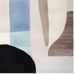 A contemporary area rug featuring an abstract design with muted colors, including shades of blue, beige, and brown. This wool rug is perfect for adding a touch of modern elegance to large living rooms.
