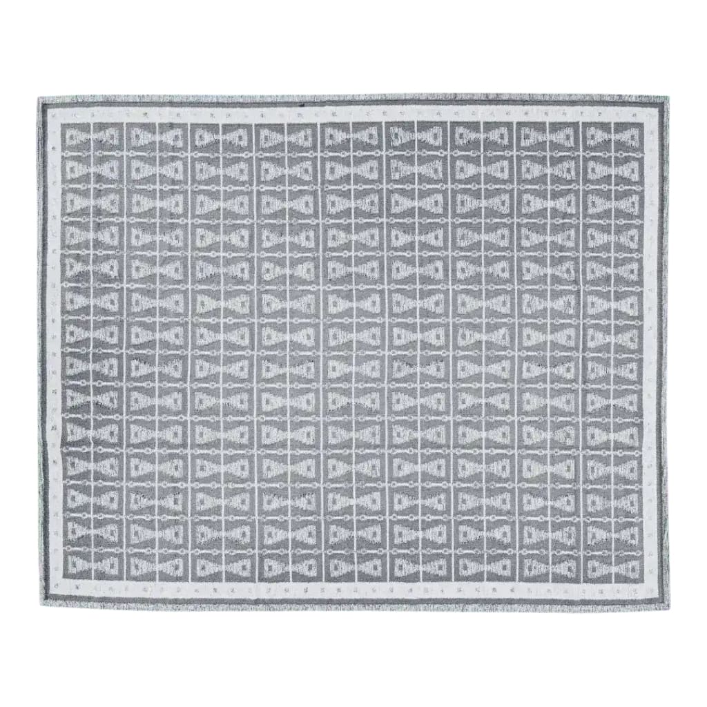 Top view of the Mystery Night Dhurrie Cotton Rug featuring a geometric pattern in muted tones, perfect for adding a boho touch to your living room. This area rug is an ideal choice for those seeking stylish living room rugs in an 8x10 size, offering both elegance and comfort.