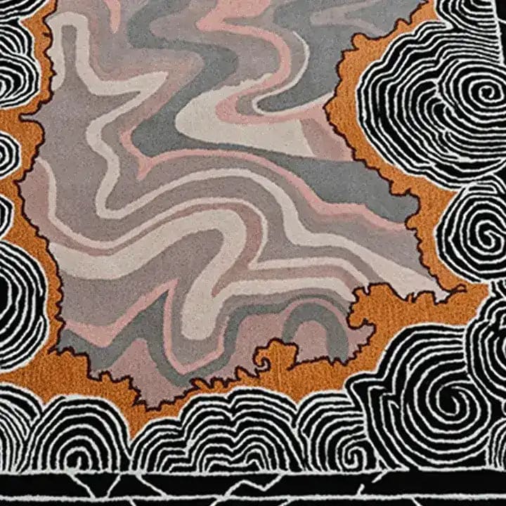 A vibrant area rug featuring an abstract design in shades of orange, pink, and grey. This hand-tufted wool rug is perfect for adding a splash of color to your bedroom or living room. The swirling patterns create a dynamic visual that complements contemporary decor.