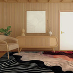A modern living room featuring the Mystic Flow Hand Tufted Viscose Rug. This contemporary area rug, sized 8x10, showcases an abstract design with flowing lines and vibrant colors, adding a touch of elegance to the wooden interior. Perfect for enhancing any space with its wool-like texture and unique style.