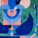A vibrant square area rug featuring an abstract design with bold colors of blue, pink, and green. This contemporary rug is hand tufted and crafted from wool, making it a perfect addition to living room rugs 8x10. The intricate patterns add a modern touch to any space, ideal for those seeking stylish rugs for living room.