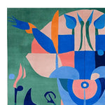 Vibrant Mystic Garden Rise hand-tufted area rug showcasing an abstract design in bold colors like blue, orange, and pink on a green background. Perfect as a square area rug for contemporary living rooms, this 8x10 wool rug adds a modern touch to any space.