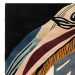 This vibrant Mystic Maze Hand Tufted Rug showcases an abstract design with bold, flowing lines and a rich palette of black, blue, beige, and brown. Perfect as an area rug for a contemporary setting, this wool rug adds a touch of modern elegance to any large living room. Ideal for spaces requiring living room rugs sized 8x10, its striking composition makes a stylish statement.