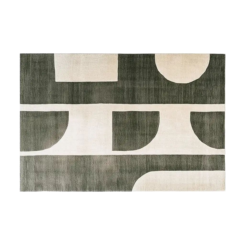 A contemporary area rug featuring an abstract geometric design in shades of dark green and cream. This wool rug adds a modern touch to any living room, perfect for those seeking stylish area rugs for living room spaces.