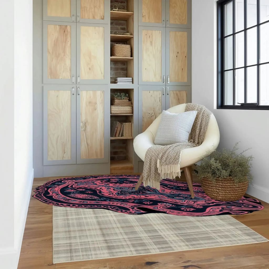 A stylish area rug in a modern living room setting, featuring the Mystic Reverie Hand Tufted Rug. The wool rug showcases an intricate abstract design with vibrant colors, perfect for enhancing the decor of living room area rugs. The image highlights how rugs for living room can transform the space, complemented by a cozy chair and natural light from a large window.