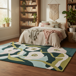 Cozy bedroom with floral rug, bed, and bookshelves.