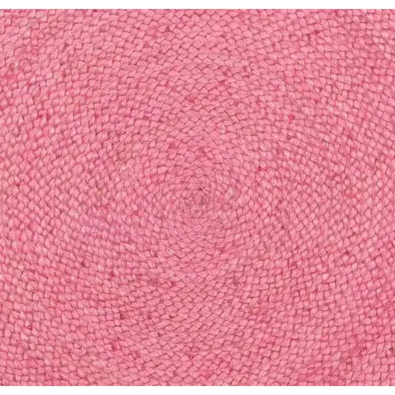 Bright pink round jute area rug, perfect for a boho-themed living room. The intricate woven pattern adds texture and warmth, making it an ideal choice for rugs in a cozy living space.