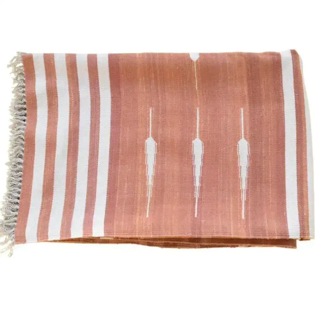 Natural vegetable dyed Indian dhurrie reversible cotton area rug in clay color, featuring a boho design with white stripes and subtle geometric patterns. Perfect for enhancing living room spaces with an 8x10 size, adding a touch of elegance and comfort to your home decor.
