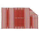 A beautiful red and white striped area rug, crafted from natural vegetable-dyed cotton, perfect for adding a boho touch to your living room or office. The reversible design of this Indian dhurrie rug makes it versatile for any space, whether you're looking for living room area rugs or office rugs.