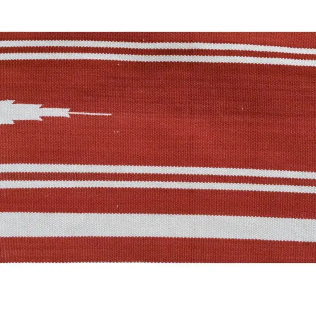 Vibrant red and white striped pattern of a Natural Vegetable Dyed Indian Dhurrie Reversible Cotton Rug. Perfect for adding a touch of boho charm to your living room area. Ideal for office spaces, this versatile area rug showcases a traditional design with a modern twist, suitable for any decor style.