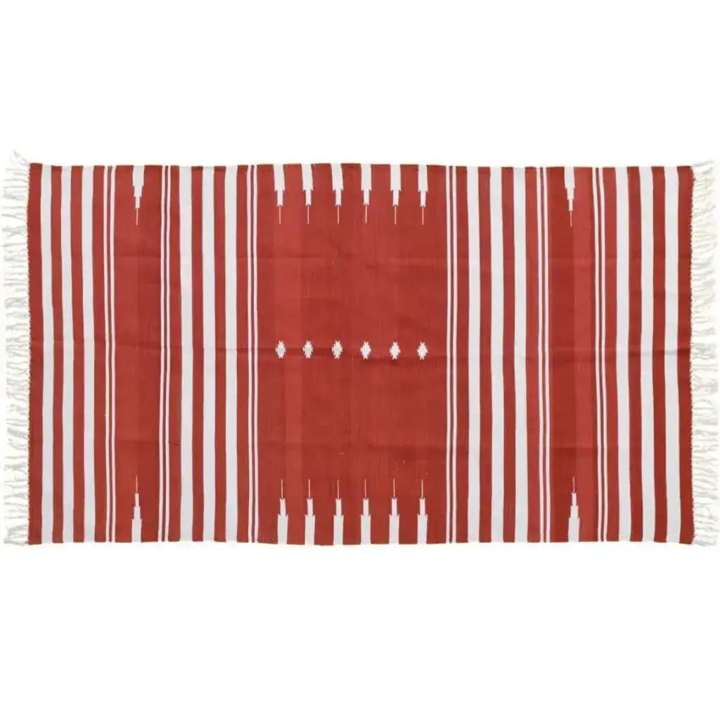 This vibrant red natural vegetable dyed Indian Dhurrie rug is perfect for adding a touch of boho charm to your living room or office. The reversible cotton rug features bold white stripes and intricate patterns, making it a versatile choice among area rugs. Ideal for those seeking cotton rugs that blend style and tradition.