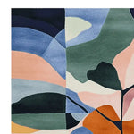 This vibrant area rug showcases an abstract design with bold, colorful shapes in shades of blue, green, pink, and orange. Perfect as a square area rug for contemporary living rooms, this 8x10 wool rug adds a touch of modern elegance to any space.