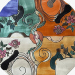 A vibrant and artistic hand-tufted round wool rug, perfect for a bedroom. This large area rug features a kaleidoscope of floral patterns in bold colors, adding a touch of nature-inspired elegance and warmth to any space.