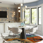 A beautifully designed dining room featuring Nature's Kaleidoscope Hand Tufted Round Rug. This large floral rug, perfect for the bedroom, showcases vibrant colors and intricate patterns, enhancing the room’s elegance. Made from high-quality wool, this area rug adds warmth and style, making it an ideal choice for rugs for bedroom settings.