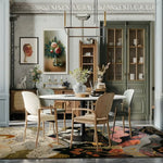 A beautifully designed area rug in a large living room setting, showcasing the Nature's Majesty Tapestry Hand Tufted Rug. The wool rug features a vibrant abstract design, perfect for living room rugs 8x10, enhancing the elegant decor with its rich colors and intricate patterns.