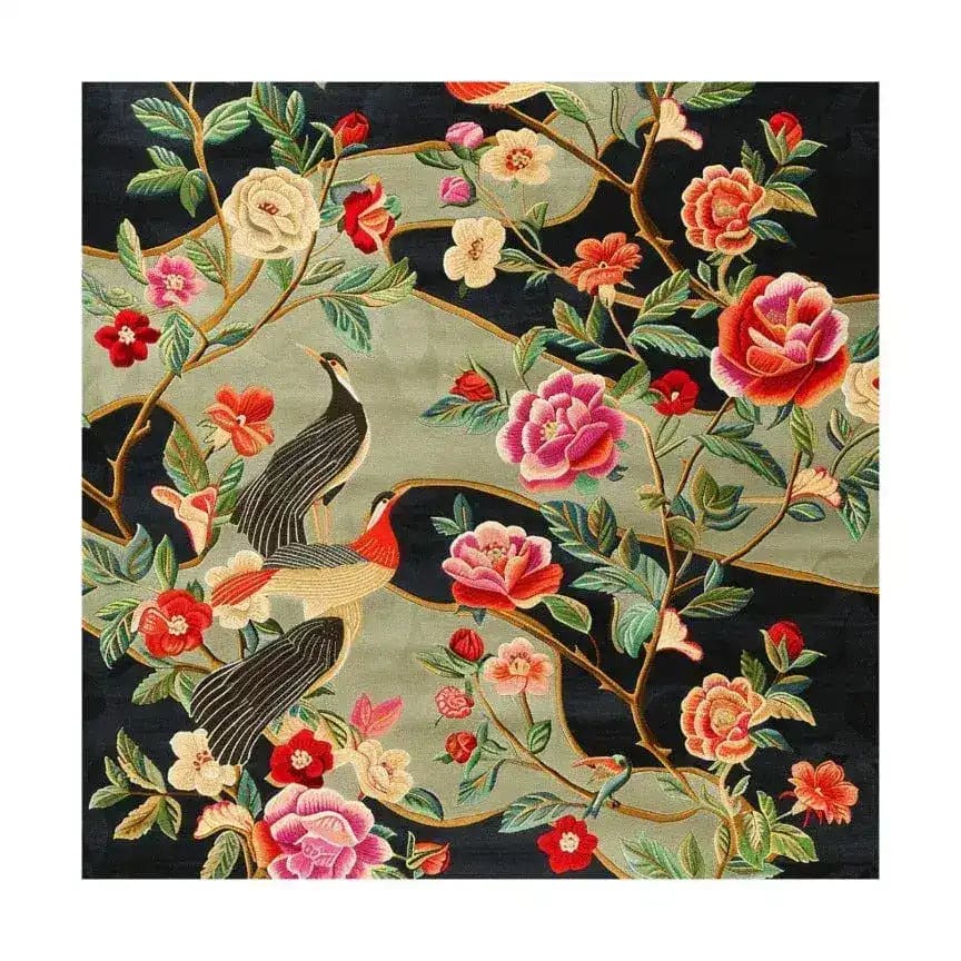 Nature’s Melody Hand Tufted Wool Rug, a vibrant square area rug featuring an intricate floral and bird design. Perfect for adding an elegant touch to your living room, this wool rug showcases colorful flowers and birds on a dark background, ideal for those seeking large area rugs for living rooms.