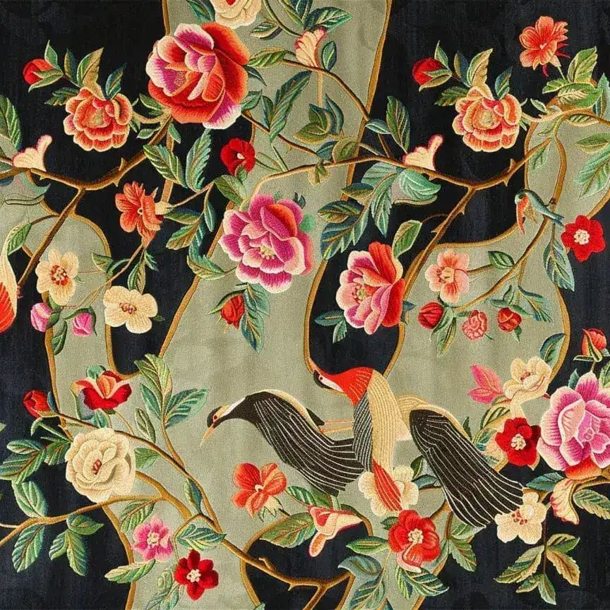 Detailed view of a Nature’s Melody Hand Tufted Wool Rug showcasing vibrant floral patterns and elegant birds, perfect for adding a touch of nature to your living room. This large square area rug is crafted from soft wool, enhancing any space with its colorful design.