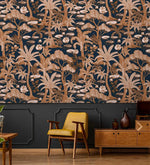 Navy and copper palm wallpaper above wainscoting with a mustard mid-century chair and wood credenza