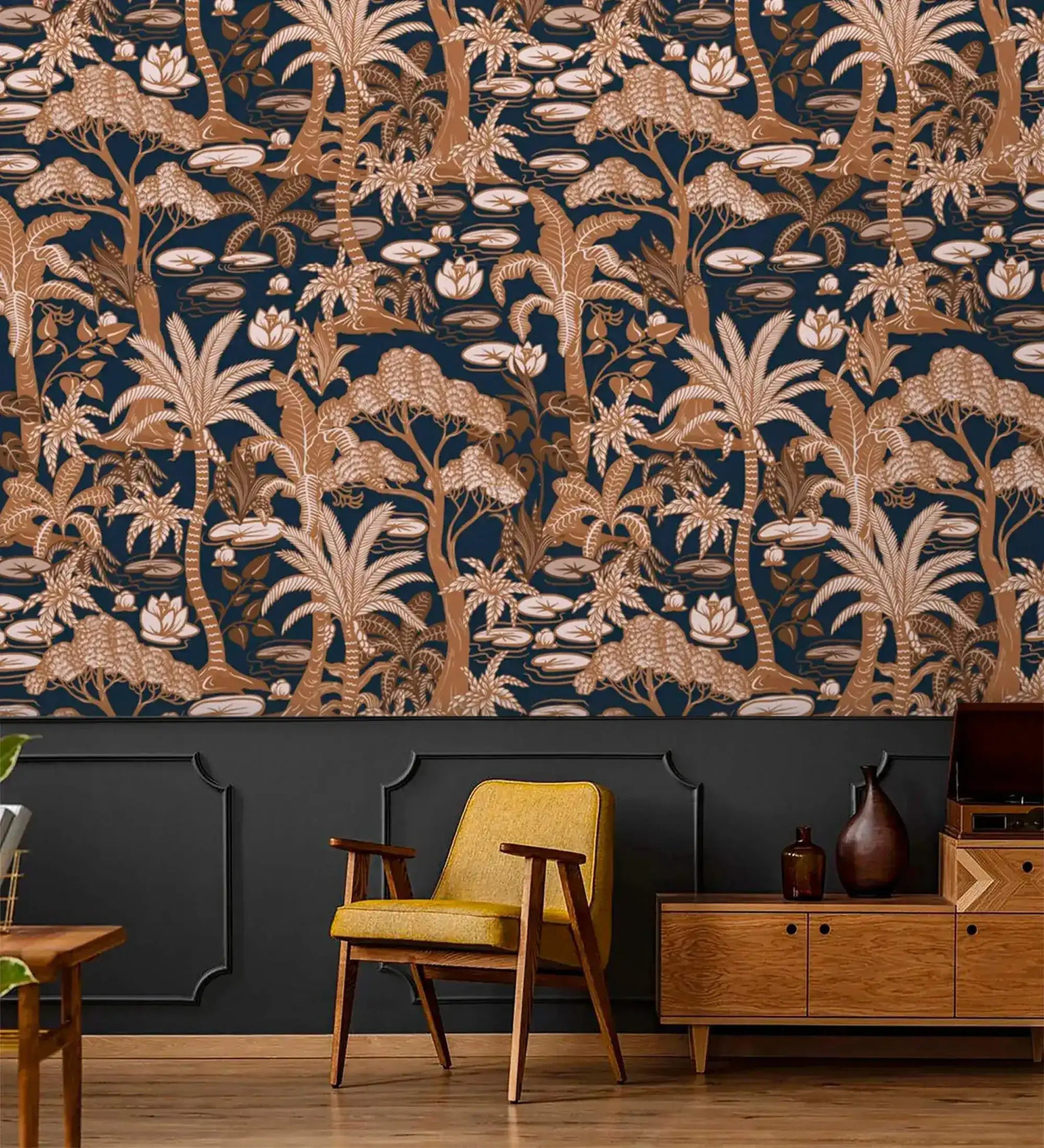 Navy and copper palm wallpaper above wainscoting with a mustard mid-century chair and wood credenza