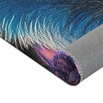 Rolled corner of blue and purple mane detail with grey anti-slip backing stitched edge, Neon King Vibrant Lion Accent Rug