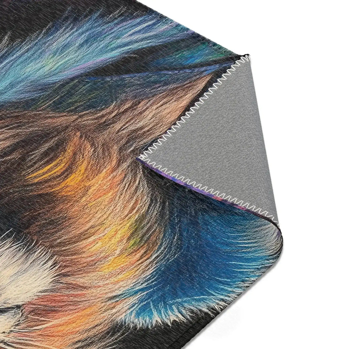 Corner fold of dark navy botanical print with orange ginkgo flower and grey non-slip backing, Neon King Vibrant Lion Accent Rug