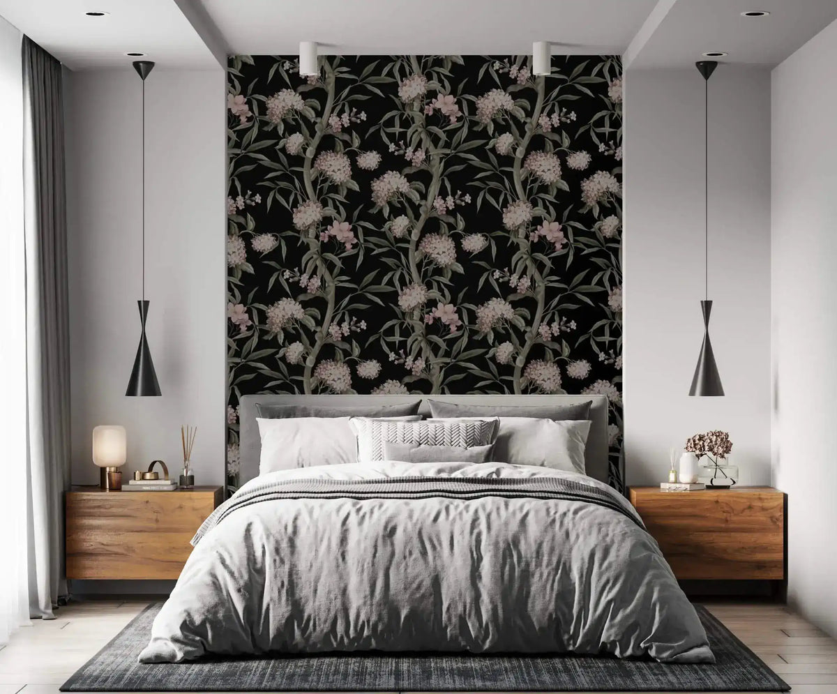 Nocturnal blossom wallpaper as bedroom accent wall, gray linen bed, wood nightstands and pendant lights
