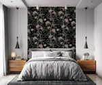 Nocturnal blossom wallpaper as bedroom accent wall, gray linen bed, wood nightstands and pendant lights