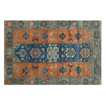This vibrant Nomadic Heritage Knotted Wool Rug features intricate patterns with bold colors like orange and blue, making it a perfect area rug for the dining room or bedroom. Its vintage design and wool texture add a touch of elegance to any living room or dining space, creating a warm and inviting atmosphere.