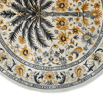 Round Oasis Reverie Hand Tufted Wool Rug featuring an intricate floral design with palm and flowers in shades of gold and gray. Perfect for adding elegance to large living room spaces, this wool rug combines beauty and durability.