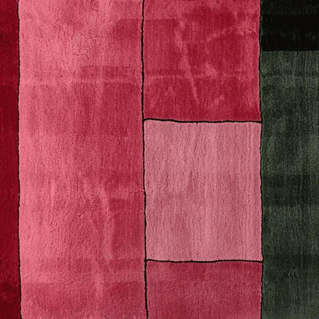 Top view of the Obscura Red Panel Hand Tufted Area Rug, showcasing a contemporary design with bold red and green panels. This wool rug is perfect for adding a modern touch to your living room area.