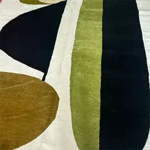 Close-up view of the Obscured Dimensions Hand Tufted Rug, featuring an abstract design with bold, earthy tones. This contemporary area rug is perfect for adding a touch of elegance to a formal dining room or as a centerpiece in a living room. Made from high-quality wool, it combines style and durability, ideal for both dining room and living room settings.