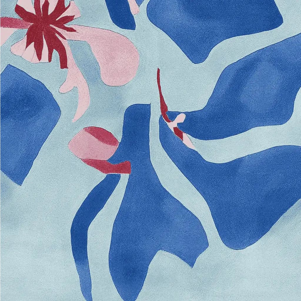 A close-up view of the Ocean Bloom Dance Hand Tufted Area Rug, featuring a contemporary abstract design in blue, pink, and red hues. Ideal for adding a modern touch to living room area rugs, this wool rug is perfect for an 8x10 space, offering a stylish and vibrant addition to any home decor.