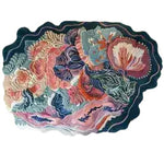 Ocean Blossom Hand Tufted Area Rug featuring a vibrant floral design with rich colors, perfect for adding a touch of elegance to living rooms or offices. This wool rug showcases intricate patterns ideal for those seeking stylish office rugs or a unique floral rug for their space.