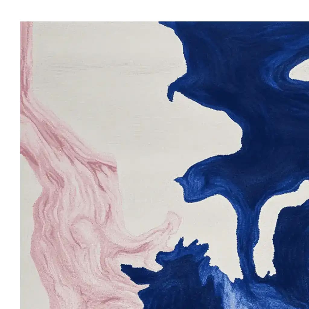 Top view of the Ocean Vein Hand Tufted Rug showcasing its mesmerizing abstract design with flowing blue and pink patterns. This contemporary wool rug is perfect for adding a touch of modern elegance to living room area rugs, making it an ideal choice for area rugs for living room spaces.