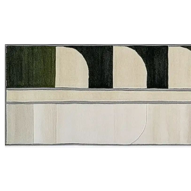 A contemporary runner rug in a geometric design with shades of green and cream, perfect for kitchens or hallways. This wool rug adds a modern touch to any space, ideal for use as a kitchen runner rug or a bathroom runner rug.
