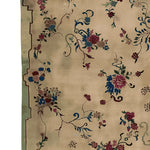 A beautifully crafted Old World Charm Hand Knotted Area Rug featuring intricate floral patterns in vibrant blues, reds, and greens on a soft beige background. This wool rug is perfect for enhancing living room decor, especially in an 8x10 setting. Ideal for those seeking elegant living room area rugs with a touch of vintage flair.
