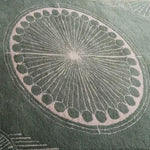 This image showcases a close-up of an Olive Green Moon Art Deco Hand Tufted Wool Rug, featuring an intricate circular pattern in soft tones. Perfect for adding a touch of elegance to your living room or office, this area rug combines style and comfort, making it an ideal choice for those seeking premium wool rugs for their space.