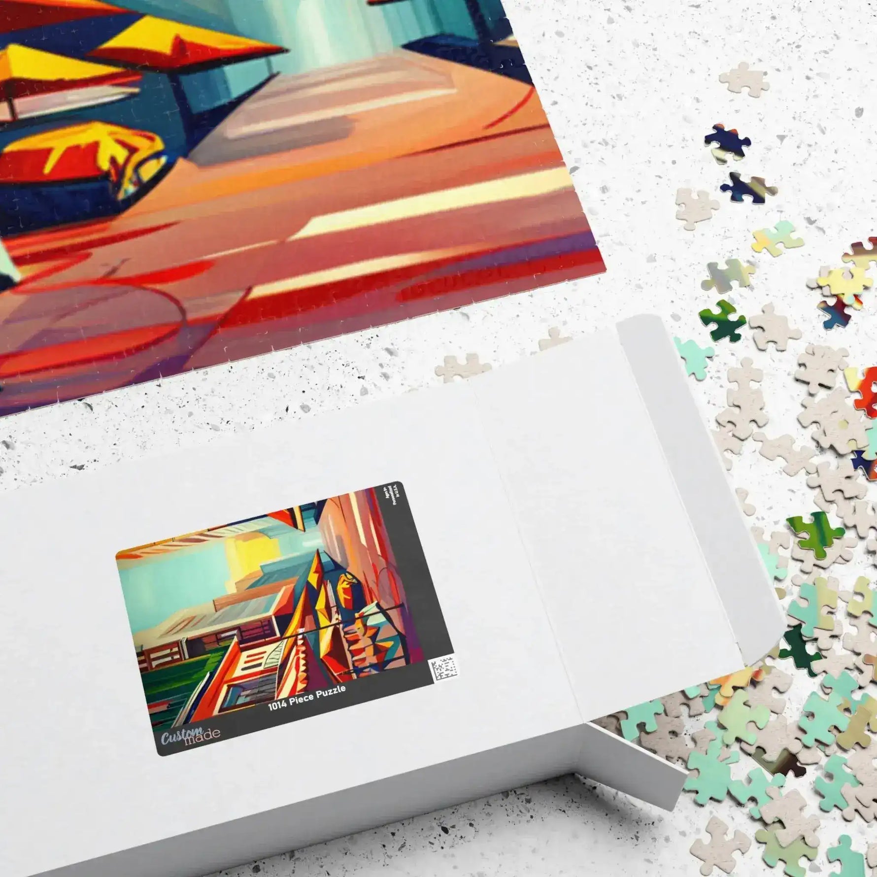 Open white Urban Vibes puzzle box with completed colorful art and pieces spilled on speckled floor