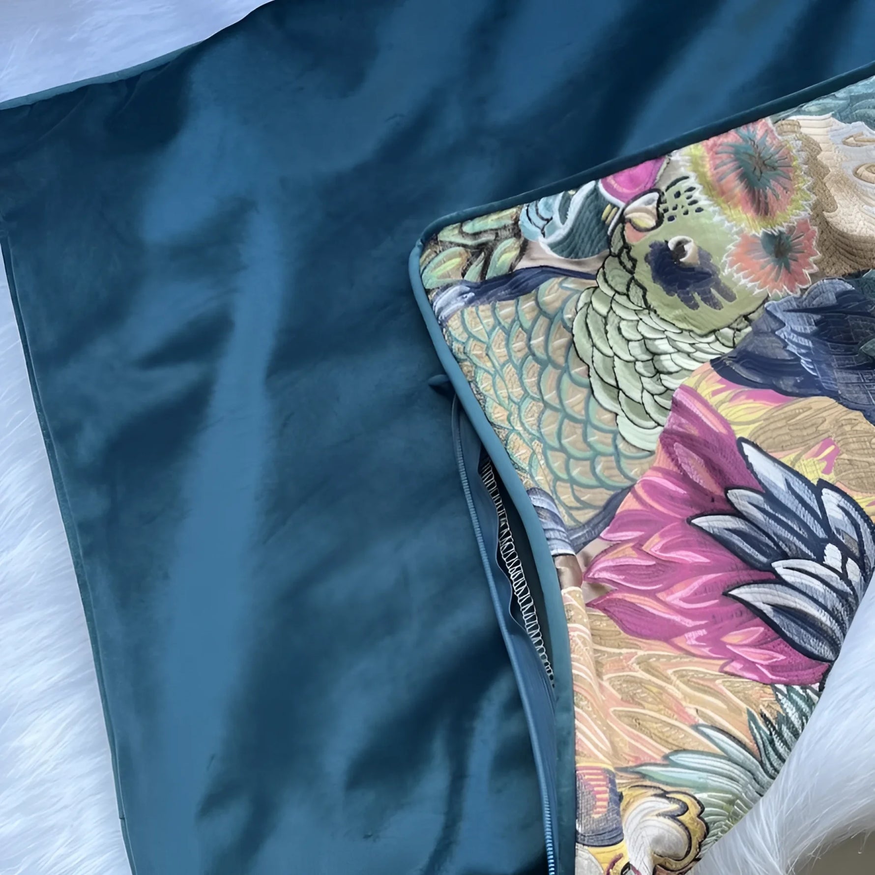 Opulent jungle aviary throw pillow cover featuring vibrant tropical patterns and a luxurious teal backing.