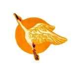 A vibrant orange Chinoiserie crane design on a hand-tufted wool rug, perfect for adding a touch of elegance to dining rooms or living room spaces. This round area rug features a striking crane flying over a radiant sun, making it a bold statement piece for any living room and dining room setting.