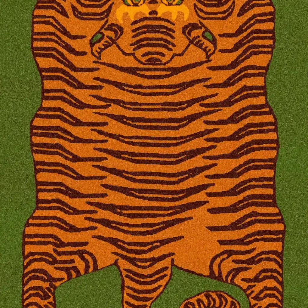 Top view of an Orange Tibetan Tiger round area rug with a striking abstract tiger design on a green background. This large wool rug is perfect for adding a bold statement to your office or as a centerpiece in large living room spaces.
