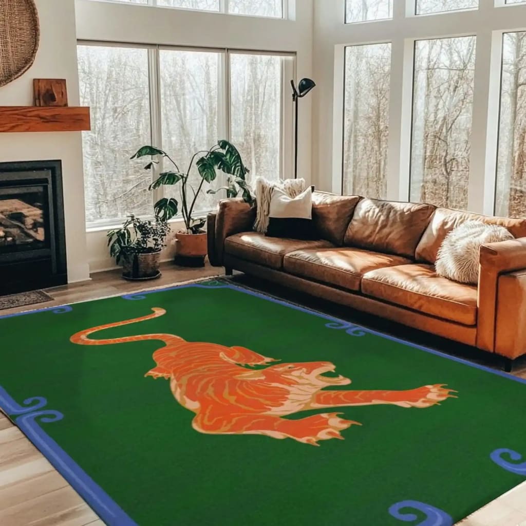 Stylish living room featuring an Orange Tiger Dark Green Hand Tufted Area Rug. This wool rug, perfect for a formal dining room or a boho-inspired space, adds a bold touch with its tiger design on a rich green background. Ideal for large area rugs in a living room, the rug complements the room's warm tones and natural light.
